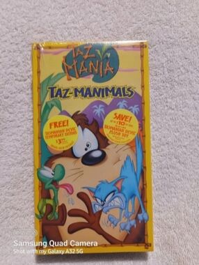Vintage Looney taz-manimals VHS video tape & tattoo